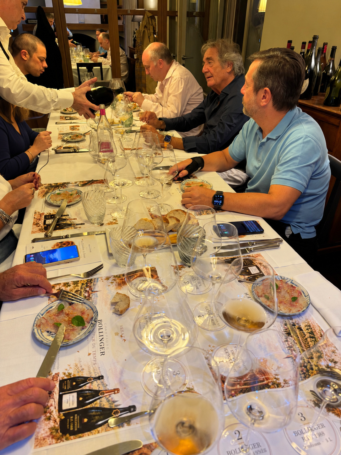 Sharing the wine: a moment during service.