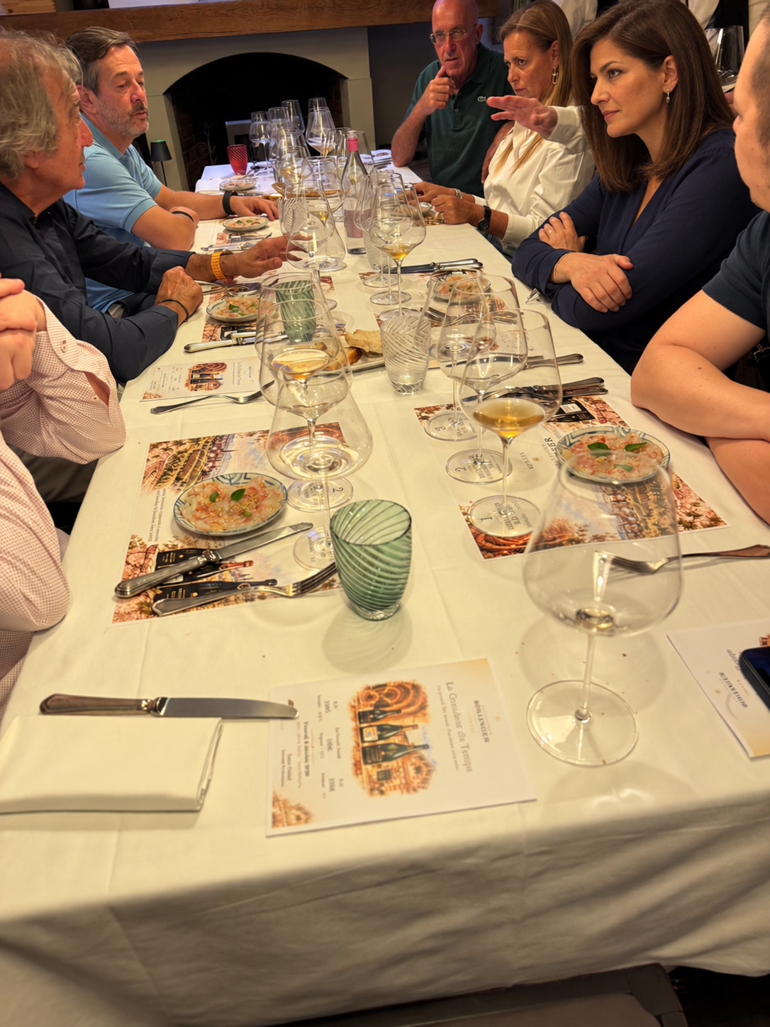 Glasses, dishes and conversation around the table.
