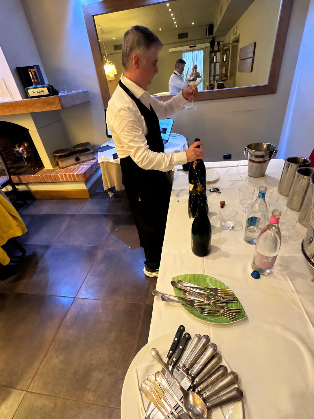 Preparing a bottle before serving.
