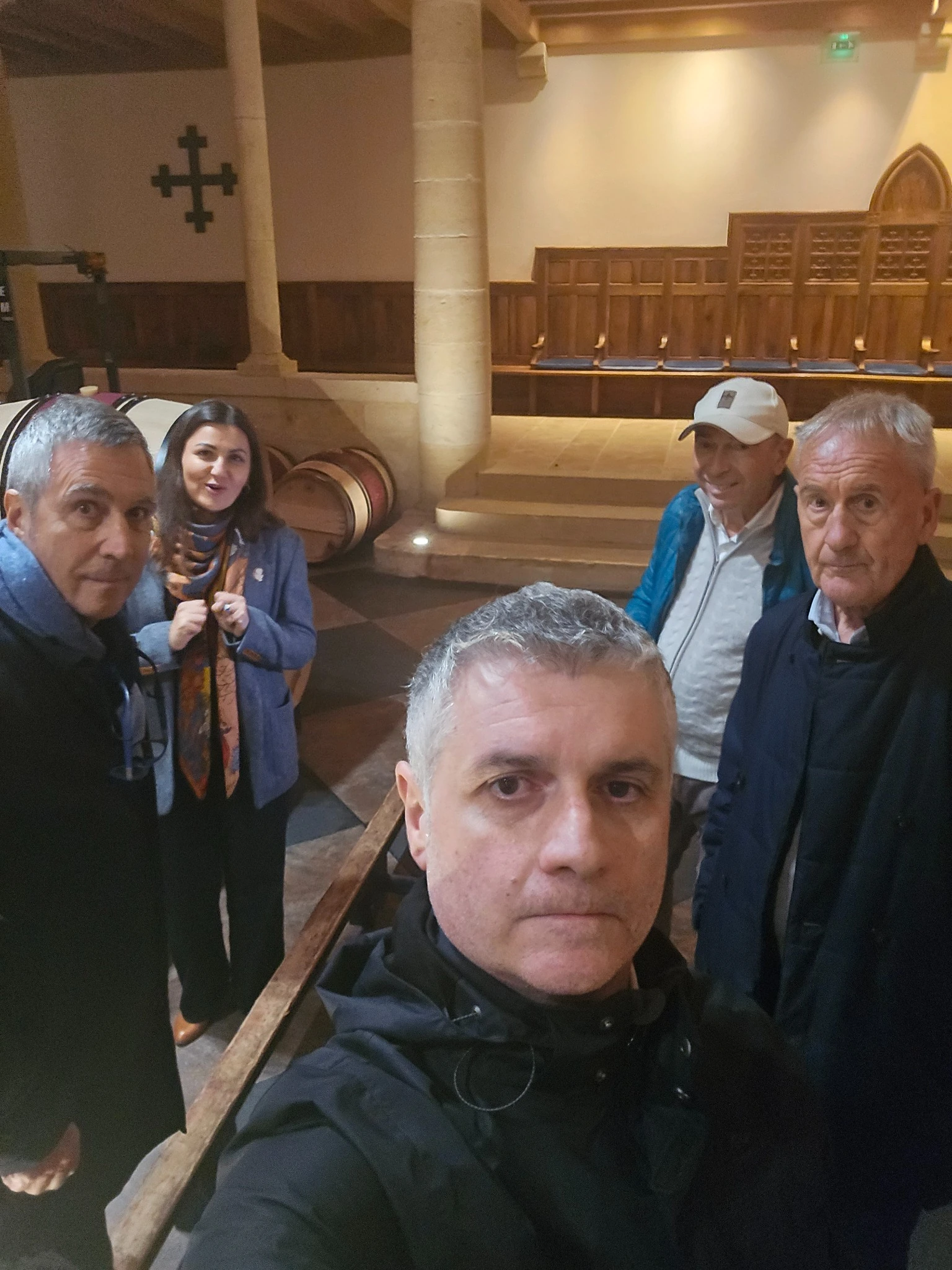 The group with our guide among the barrels at La Mission Haut-Brion